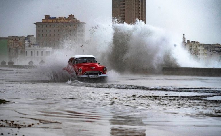 Huge waves and high winds hurl jellyfish and seaweed into the streets of Havana