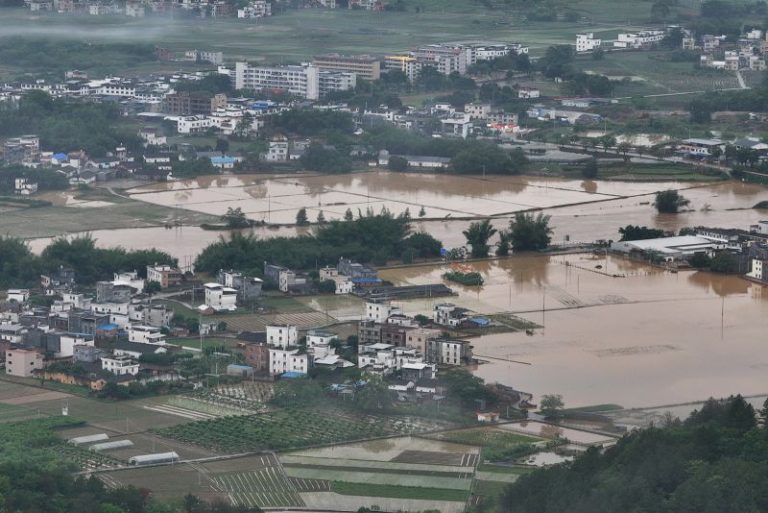 Massive floods threaten tens of millions as intense rains batter southern China